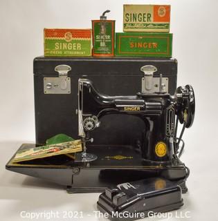 Singer Featherweight Sewing Machine with Accompanying Attachments in Box.