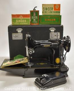 Singer Featherweight Sewing Machine with Accompanying Attachments in Box.