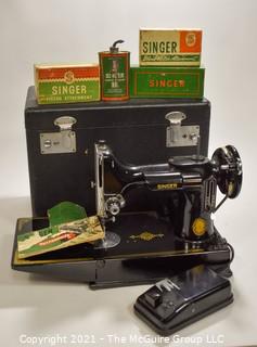 Singer Featherweight Sewing Machine with Accompanying Attachments in Box.