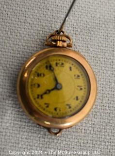 Vintage Ladies Gold Filled Pendant Watch, Swiss 15 Jewel Movement with Fahys Case.  Measures approximately 1" in diameter.  Untested. 