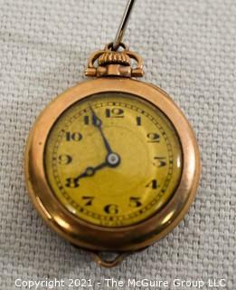 Vintage Ladies Gold Filled Pendant Watch, Swiss 15 Jewel Movement with Fahys Case.  Measures approximately 1" in diameter.  Untested. 