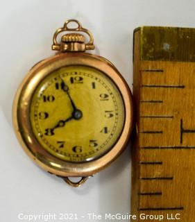 Vintage Ladies Gold Filled Pendant Watch, Swiss 15 Jewel Movement with Fahys Case.  Measures approximately 1" in diameter.  Untested. 