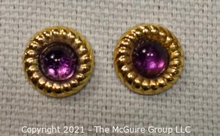 14 Kt Gold Round Stud Earrings with Purple Gemstone Center.  They measure approximately 1/2" in diameter and weigh approximately .9 gr. 