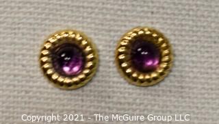 14 Kt Gold Round Stud Earrings with Purple Gemstone Center.  They measure approximately 1/2" in diameter and weigh approximately .9 gr. 