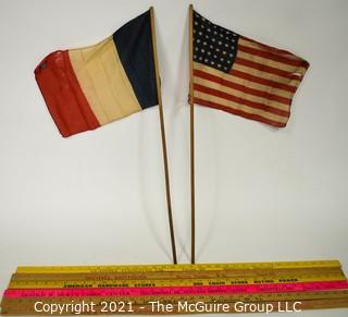 Grouping of six Yard Sticks with Advertising and Vintage French Flag and US Flags (48 stars)