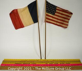 Grouping of six Yard Sticks with Advertising and Vintage French Flag and US Flags (48 stars)