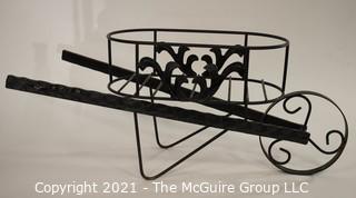 Metal Wheelbarrow Flower Cart.  Measures approximatley 27"wide x 12" tall.