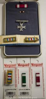 Collectible: Militaria: assortment of ribbons in case from another medal and Pistol Sharpshooter medal