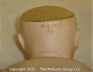 Collectible: Doll:  marked "M&M" dated 1981 bisque head doll w/ jointed composition body in royal blue outfit