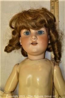 Collectible: Doll:  marked "Armand Marselle" German bisque head doll w/ jointed composition body in lace outfit