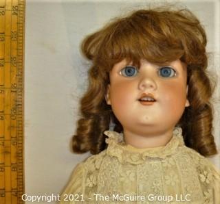 Collectible: Doll:  marked "Armand Marselle" German bisque head doll w/ jointed composition body in lace outfit