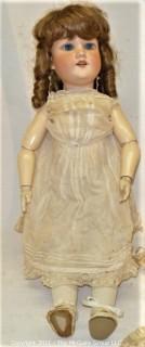 Collectible: Doll:  marked "Armand Marselle" German bisque head doll w/ jointed composition body in lace outfit