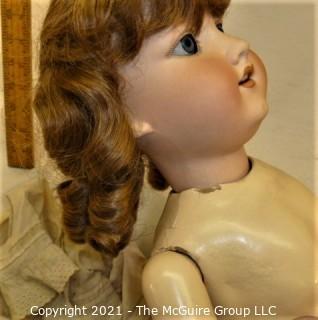 Collectible: Doll:  marked "Armand Marselle" German bisque head doll w/ jointed composition body in lace outfit