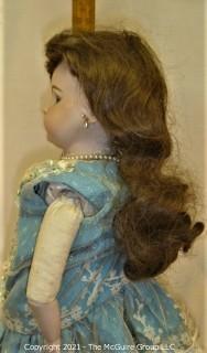 Collectible: Doll: leather and cloth soft body w/ Simon & Halbig German bisque head and socketed shoulders circa 1912 in blue dress