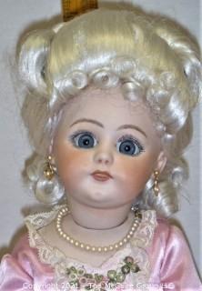 Collectible: Doll: bisque and cloth soft body w/ Simon & Halbig German bisque head and socketed shoulders circa 1912 in pink dress