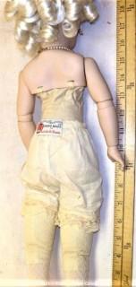 Collectible: Doll: bisque and cloth soft body w/ Simon & Halbig German bisque head and socketed shoulders circa 1912 in pink dress