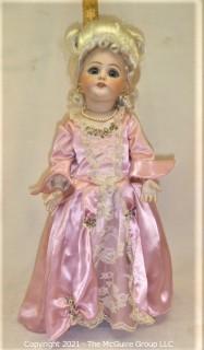 Collectible: Doll: bisque and cloth soft body w/ Simon & Halbig German bisque head and socketed shoulders circa 1912 in pink dress