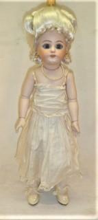 Collectible: Doll: bisque and cloth soft body w/ Simon & Halbig German bisque head and socketed shoulders circa 1912 in pink dress