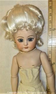 Collectible: Doll: bisque and cloth soft body w/ Simon & Halbig German bisque head and socketed shoulders circa 1912 in pink dress