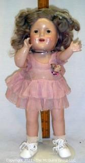 Collectible: Doll:  unmarked 15" "Shirley Temple" doll w/ composition body  and pink dress ~1930's