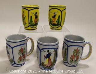 Set of Five (5) Henriot Quimper French Faience Tulip Shaped Mugs in Soleil Yellow and White with Both a Lady & Gentlemen on the Side.  Each measures approximately 4" tall. 