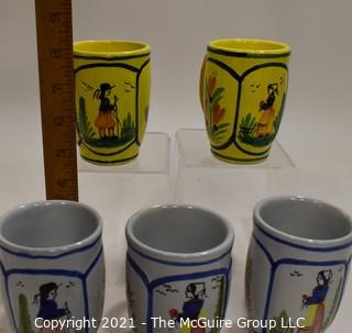 Set of Five (5) Henriot Quimper French Faience Tulip Shaped Mugs in Soleil Yellow and White with Both a Lady & Gentlemen on the Side.  Each measures approximately 4" tall. 