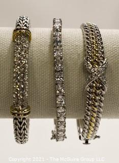 Three (3) Silver Tone Bangle Bracelets with Rhinestone Accents.