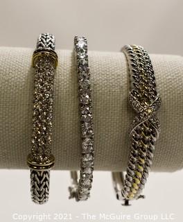 Three (3) Silver Tone Bangle Bracelets with Rhinestone Accents.