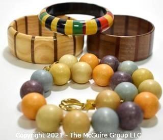 Four (4) Pieces of Vintage Wooden Crafted Jewely - Three (3) Bangle Bracelets and One (1) Bead Necklace.