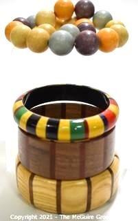 Four (4) Pieces of Vintage Wooden Crafted Jewely - Three (3) Bangle Bracelets and One (1) Bead Necklace.