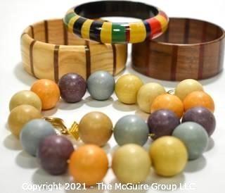 Four (4) Pieces of Vintage Wooden Crafted Jewely - Three (3) Bangle Bracelets and One (1) Bead Necklace.