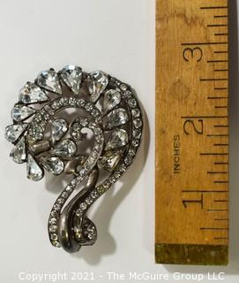 Vintage Eisenberg Original Sterling Silver Rhinestone Brooch or Pin in Flourish Design.   Measures approximately 3" Tall and 2" wide. 
