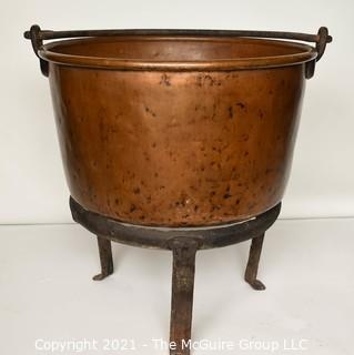 Antique Hammered Large Copper Cauldron with Hand Forged Iron Base and Handle.  Measures 43"T (with handle) x 27" D (at top).  Base Measure 14"T.  Includes wood insert. 