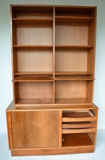 Danish Mid Century Modern (MCM)  Stacking Teak Bookcase & Credenza with Adjustable Shelves, Some Slide Out.   Stamped Made in Denmark by Poul Hundevad. Some damage to base.  