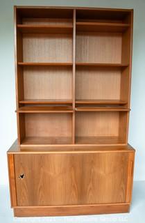 Danish Mid Century Modern (MCM)  Stacking Teak Bookcase & Credenza with Adjustable Shelves, Some Slide Out.   Stamped Made in Denmark by Poul Hundevad. Some damage to base.  