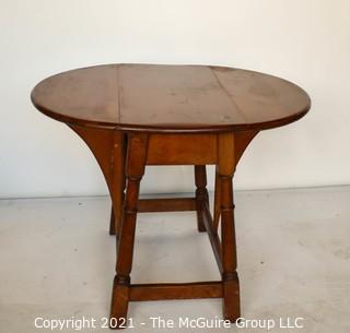 Vintage Maple Drop-Leaf End Table.  Measures 28"W x 23"T  (12"W when closed)