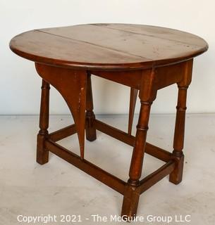 Vintage Maple Drop-Leaf End Table.  Measures 28"W x 23"T  (12"W when closed)