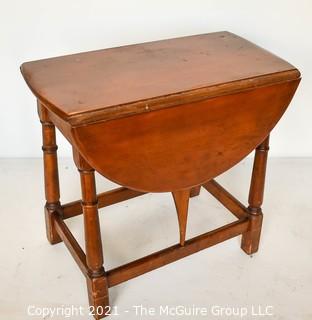 Vintage Maple Drop-Leaf End Table.  Measures 28"W x 23"T  (12"W when closed)