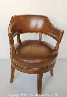 Vintage Leather Barrel Style Office Chair with Brass Tack Accents on Swivel Base.  Measures 37"T x 24" W.