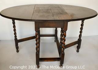 Antique English Oak Barley Twist Gateleg Table.  Measures 53" D when open.