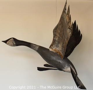 Primitive Hanging Painted Metal Folkart Sculpture of a Canadian Goose.  Wingspan measures 36"L. 