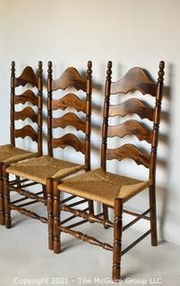 Three (3) Ladder-Back Dining Chairs with Wicker Seats and turned spindle legs