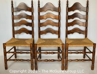 Three (3) Ladder-Back Dining Chairs with Wicker Seats and turned spindle legs