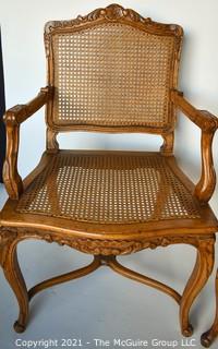 Two (2) French Provincial Style Cane Seat Arm Chairs with Carved Back and Arms. 