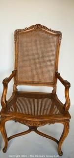 Two (2) French Provincial Style Cane Seat Arm Chairs with Carved Back and Arms. 