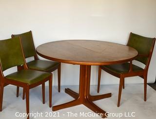 Danish Mid Century Modern MCM Teak Dining Table with Three (3) Chairs and Two (2) Leaves Made By J.O. Carlsson For Vetlanda .  Measures  29"T x 47" D.  Each leaf measures 24"W.