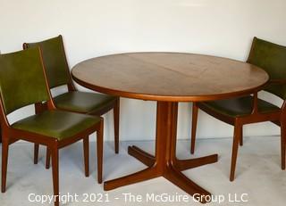 Danish Mid Century Modern MCM Teak Dining Table with Three (3) Chairs and Two (2) Leaves Made By J.O. Carlsson For Vetlanda .  Measures  29"T x 47" D.  Each leaf measures 24"W.