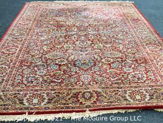 Machine Woven Oriental Rug with Red Ground, Made in Belgium.  Measures 104"L X 96"W.