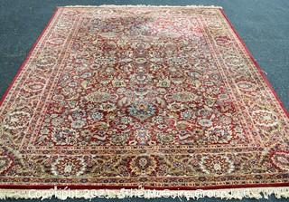 Machine Woven Oriental Rug with Red Ground, Made in Belgium.  Measures 104"L X 96"W.