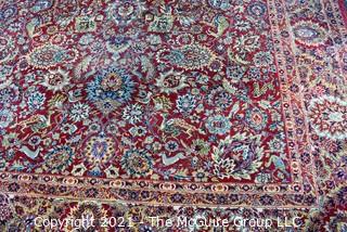 Machine Woven Oriental Rug with Red Ground, Made in Belgium.  Measures 104"L X 96"W.